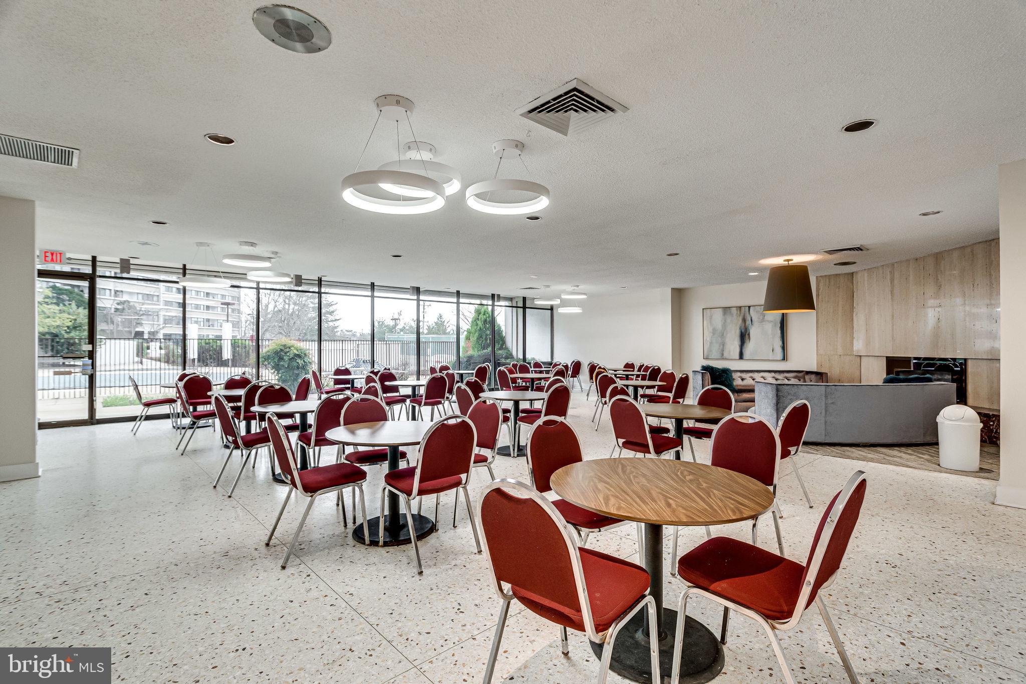 6101 Edsall Road, Unit 312 Alexandria, VA 22304 - Photo 39 of 57 a room with lots of chairs and a large window