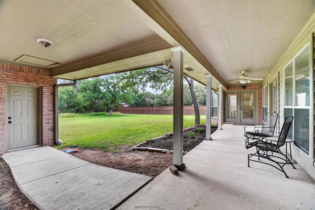 309 Verde Road Willow Park, TX 76087 - Photo 32 of 38 Covered porch and porteche that leads to the garage and unfinished bonus room