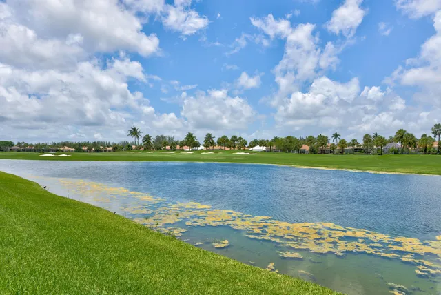 a view of a lake with houses in the back