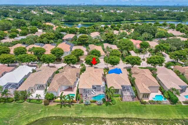 an aerial view of residential house with outdoor space and parking