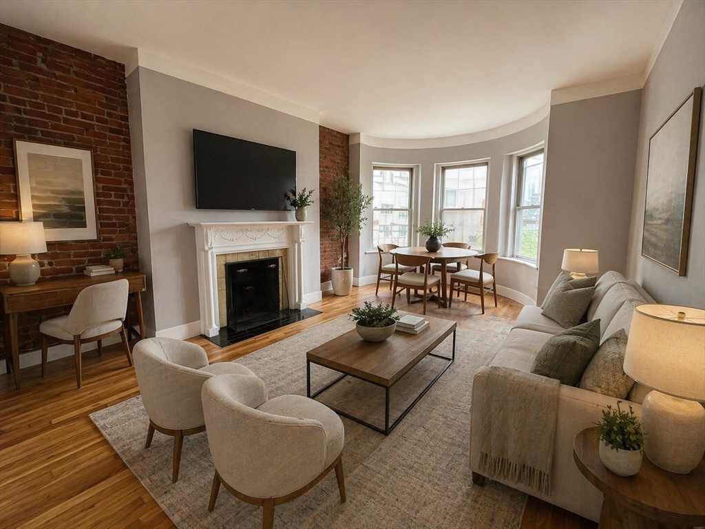 198 St Botolph Street, Unit 8 Boston, MA 02115 - Photo 1 of 7 a living room with furniture fireplace and a flat screen tv
