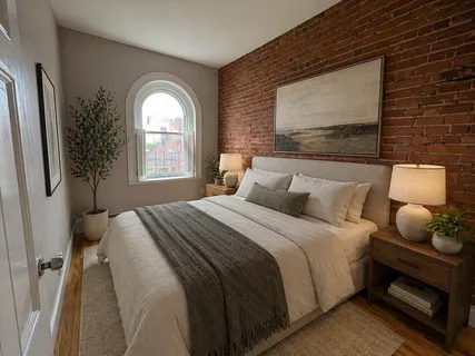 a bedroom with bed and window