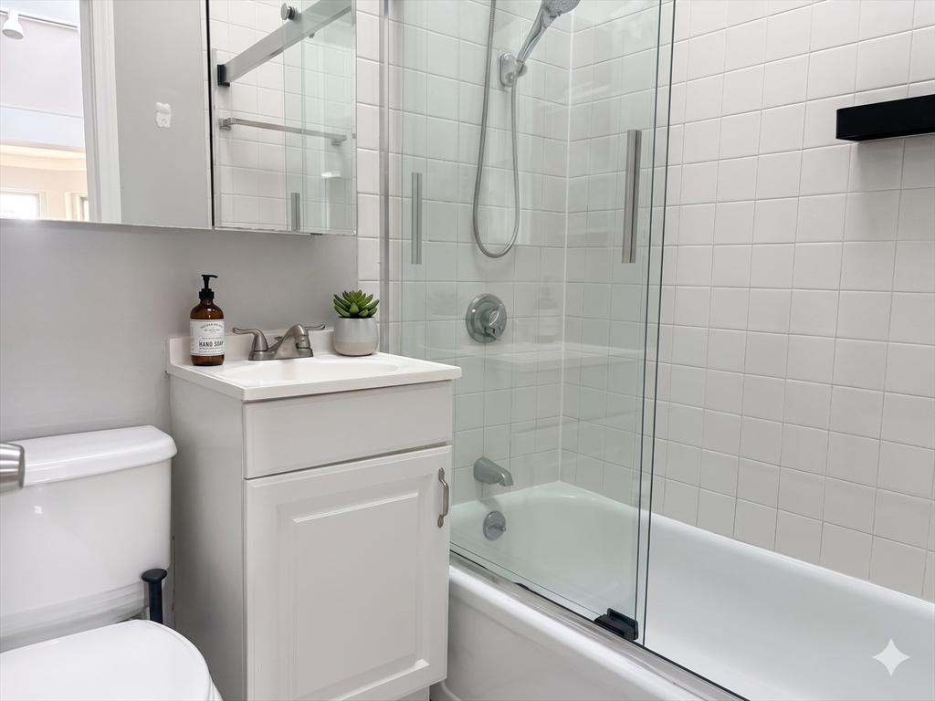 198 St Botolph Street, Unit 8 Boston, MA 02115 - Photo 4 of 7 a bathroom with a sink toilet and shower