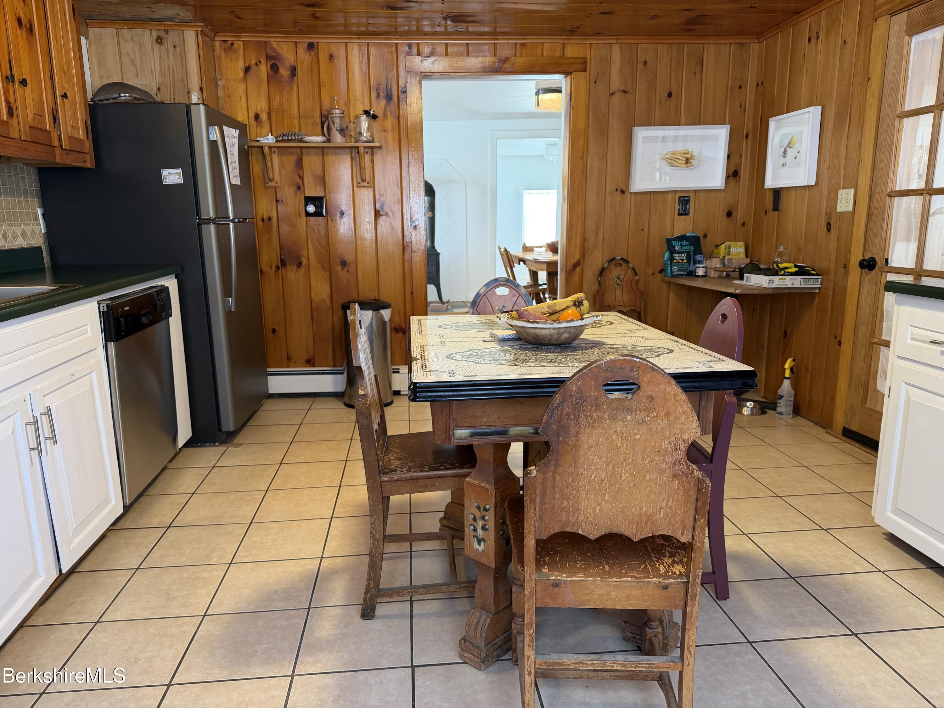 95 Water Farm Road Sheffield, MA 01257 - Photo 11 of 27 a dining room with a sink and a refrigerator