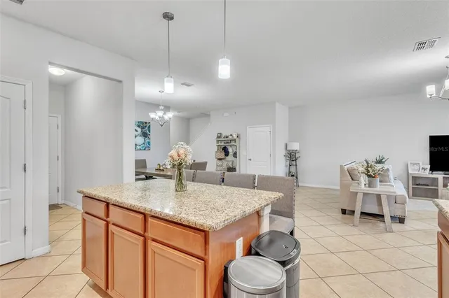 a view of living room with granite countertop furniture and fireplace