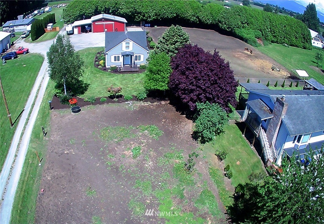 17815 Dunbar Road Mount Vernon, WA 98273 - Photo 2 of 29 a front view of house with yard and mountain view in back