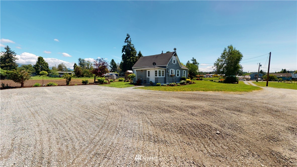 17815 Dunbar Road Mount Vernon, WA 98273 - Photo 13 of 29 a view of a house with a yard and sitting area