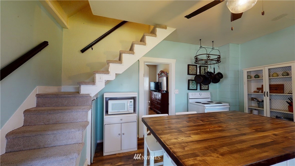 17815 Dunbar Road Mount Vernon, WA 98273 - Photo 23 of 29 a view of a hallway with wooden floor and staircase