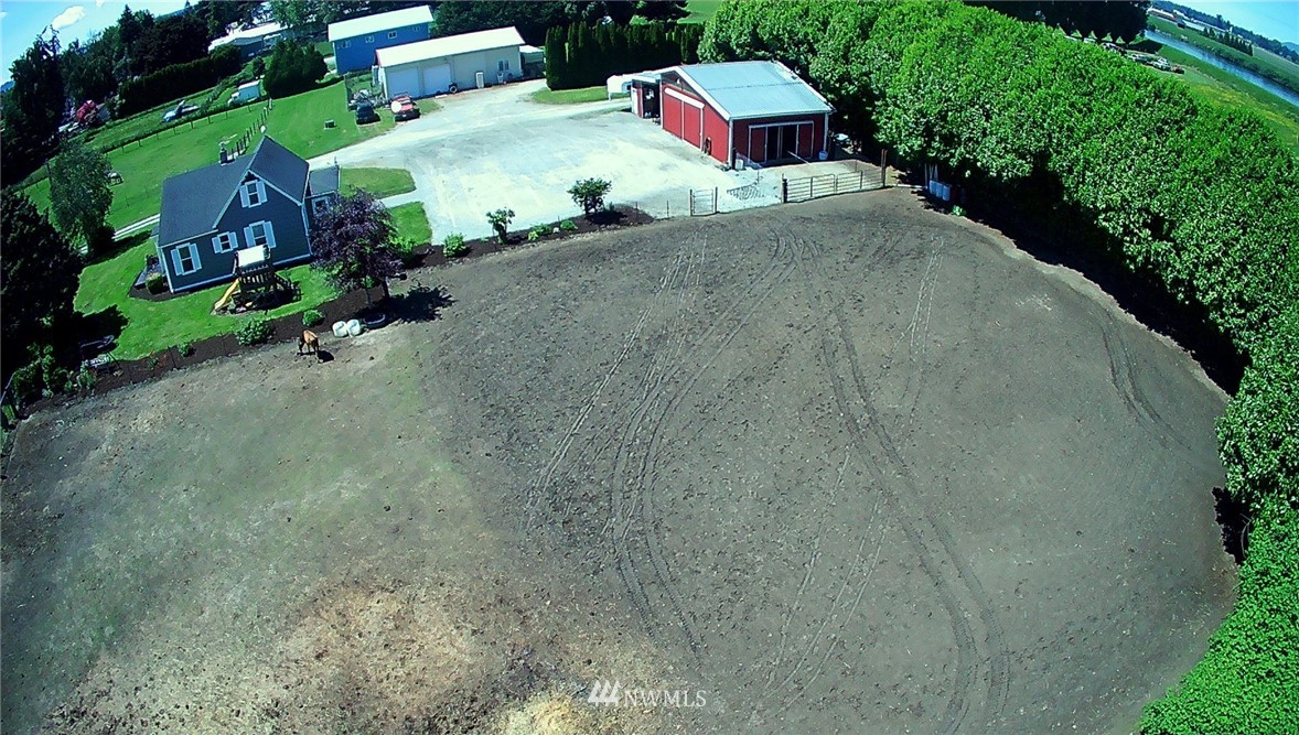 17815 Dunbar Road Mount Vernon, WA 98273 - Photo 4 of 29 an aerial view of a house with a yard and lake view