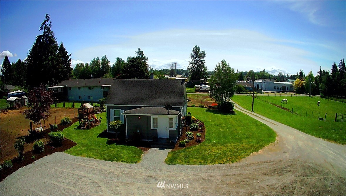 17815 Dunbar Road Mount Vernon, WA 98273 - Photo 6 of 29 an aerial view of a house with a garden and trees