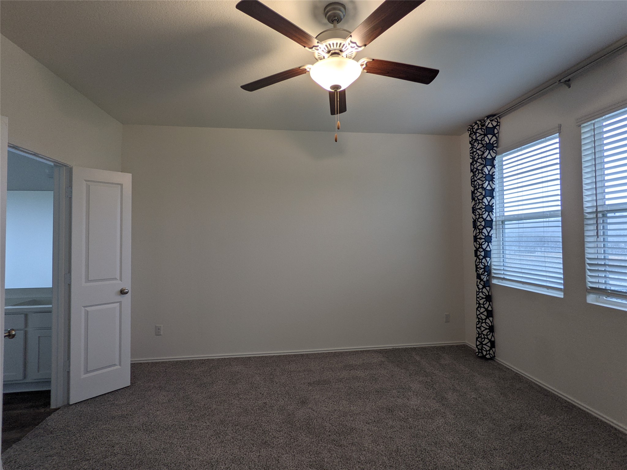 100 Montauk Loop Georgetown, TX 78628 - Photo 10 of 21 A well-proportioned bedroom offers comfort with a ceiling fan and an adjoining bathroom.