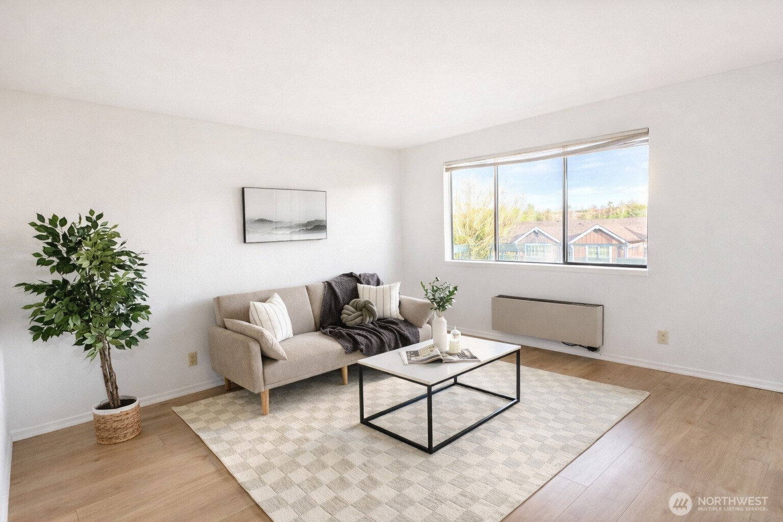318 South 174th Place, Unit K Burien, WA 98148 - Photo 4 of 12 a living room with furniture and a potted plant