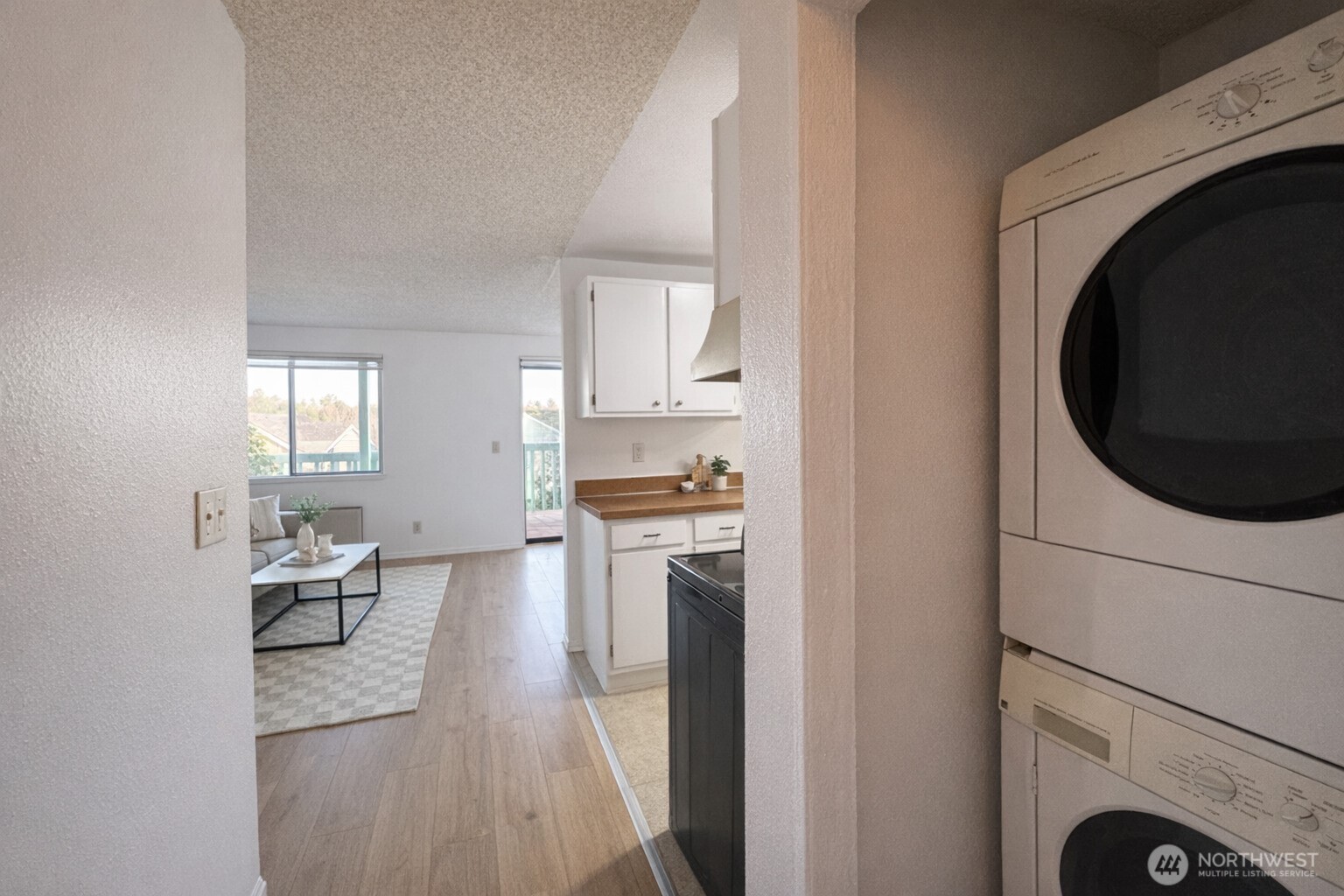 318 South 174th Place, Unit K Burien, WA 98148 - Photo 9 of 12 a living room with furniture and a fireplace