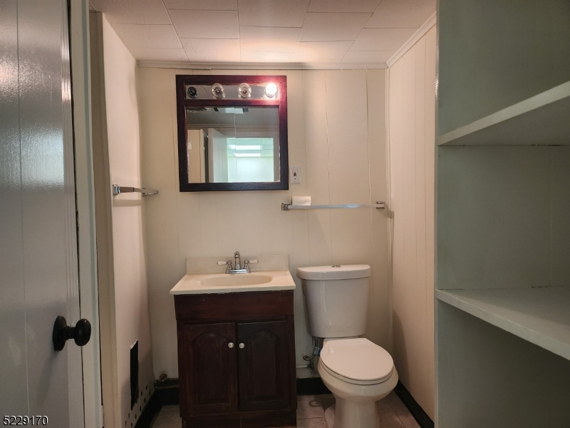 374 Rte 24 Chester, NJ 07930 - Photo 12 of 15 a bathroom with a toilet sink and mirror