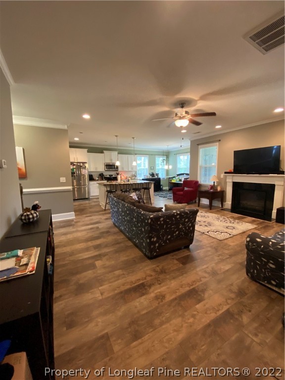 144 Moultrie Lane Aberdeen, NC 28315 - Photo 15 of 49 a large room with furniture a large window and a fireplace