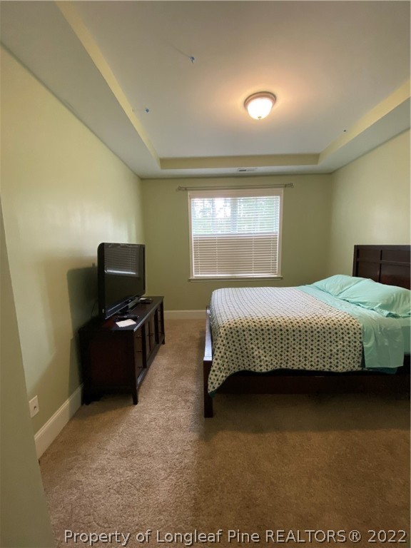 144 Moultrie Lane Aberdeen, NC 28315 - Photo 17 of 49 a bedroom with a bed and television