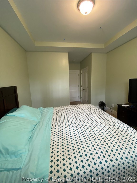 144 Moultrie Lane Aberdeen, NC 28315 - Photo 18 of 49 a bedroom with a bed and a lamp