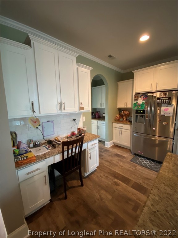 144 Moultrie Lane Aberdeen, NC 28315 - Photo 10 of 49 a kitchen that has a lot of cabinets in it and appliances