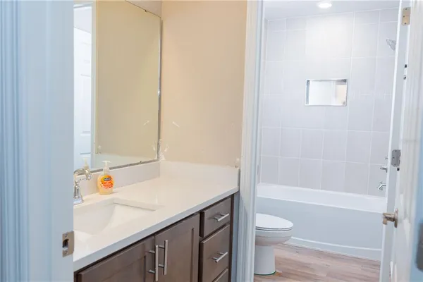 a bathroom with a bathtub and a toilet