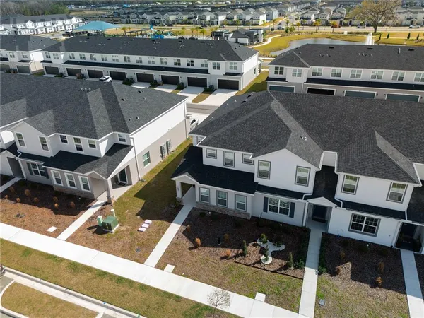 an aerial view of residential houses with outdoor space