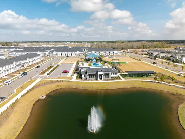 an aerial view of a house with a swimming pool