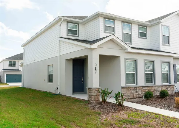 a room with a bed and a table in it