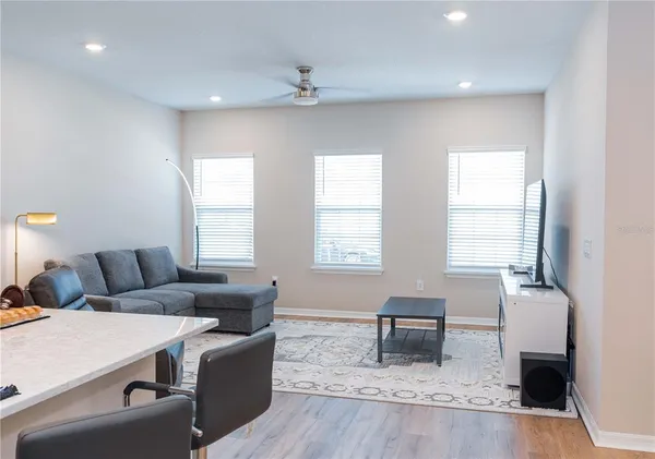 a living room with furniture and a window