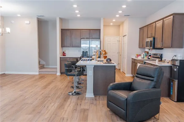 a kitchen with a sink stove and microwave