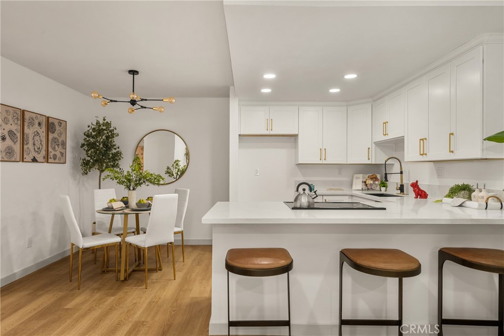 3010 Associated Road, Unit 122 Fullerton, CA 92835 - Photo 4 of 17 a kitchen with stainless steel appliances granite countertop a sink and a stove