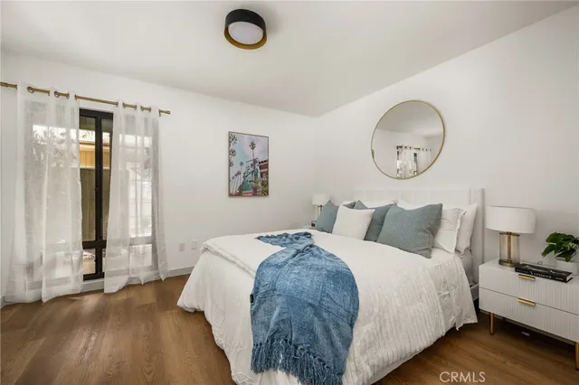 a bedroom with bed and a window