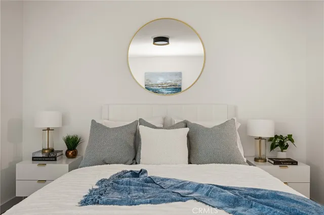 a large bed in a white room