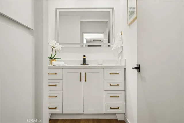 a close view of a dresser and mirror