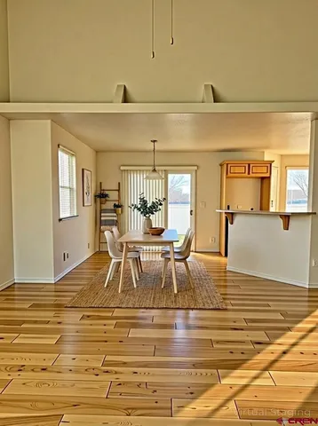 a view of a kitchen with furniture and floor to ceiling window