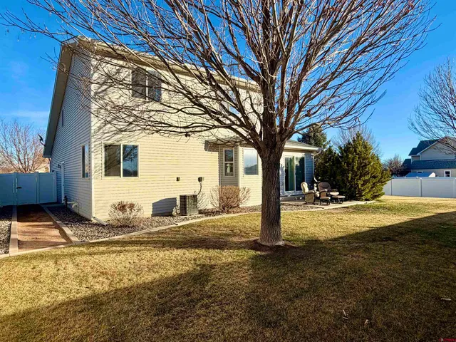 a view of a house with snow on the road