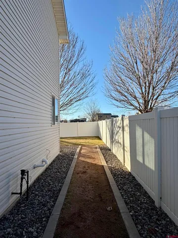 a view of a backyard of the house