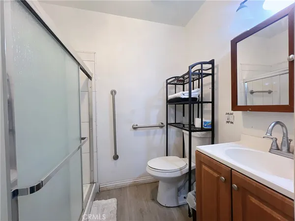 a bathroom with a toilet a sink and a shower