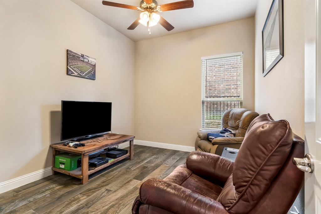 3610 Bastrop Street Melissa, TX 75454 - Photo 13 of 23 a living room with furniture and a flat screen tv