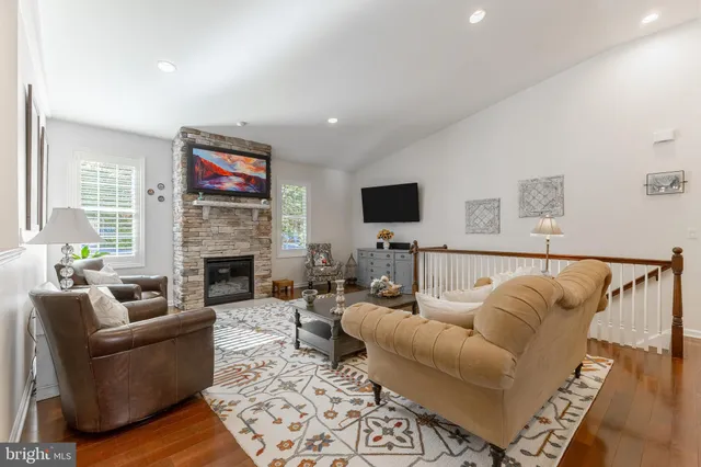 a kitchen with granite countertop a stove top oven sink and cabinets