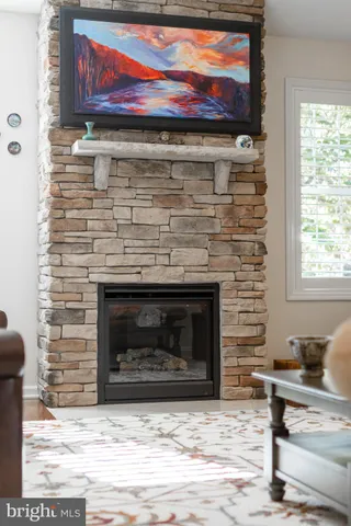 a kitchen with granite countertop a sink and white cabinets