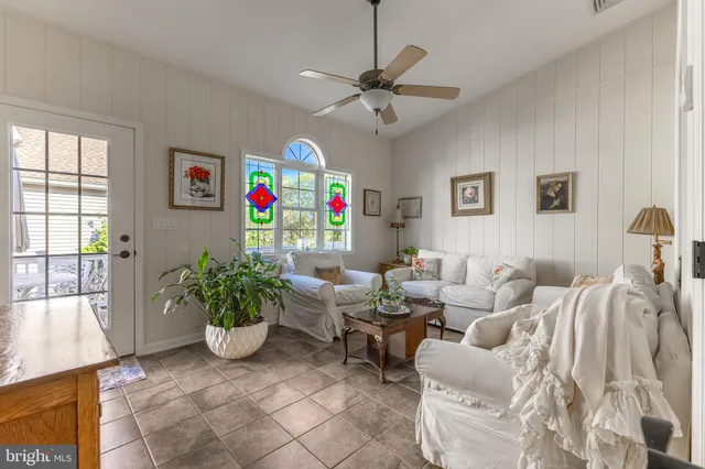 a bathroom with a sink double vanity granite tub shower and mirror
