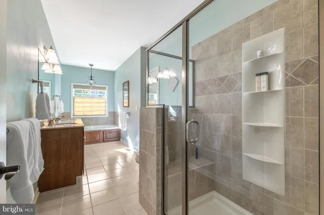 a large white kitchen with a sink and dishwasher stove
