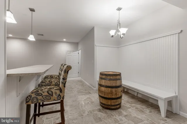 a balcony with wooden floor and furniture