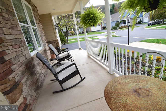 a view of a chairs and table in the patio