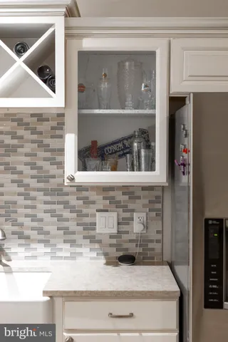 a view of a house with a big yard and a large trees