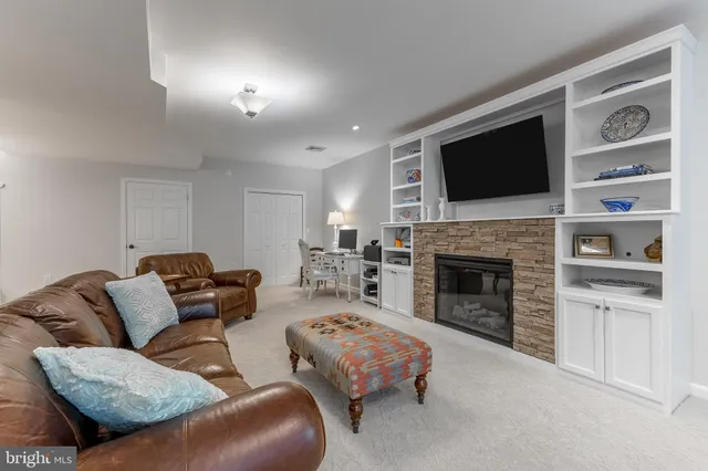 a sign board with a tree in a yard