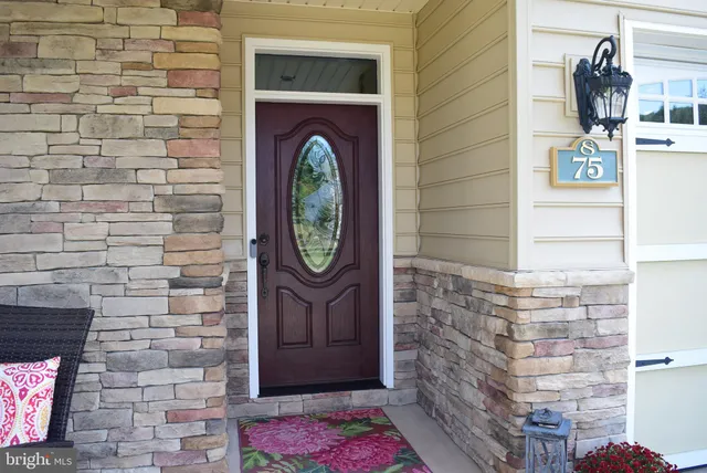 a brick building with a sign on it