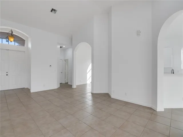 a view of an empty room with a fireplace