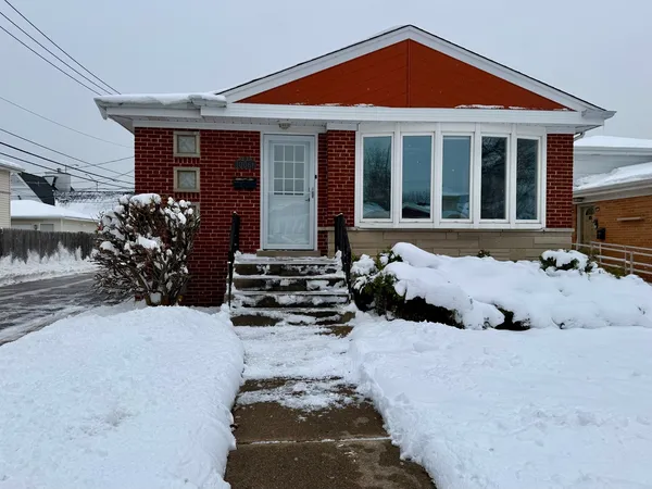 a view of a house with a yard and garage