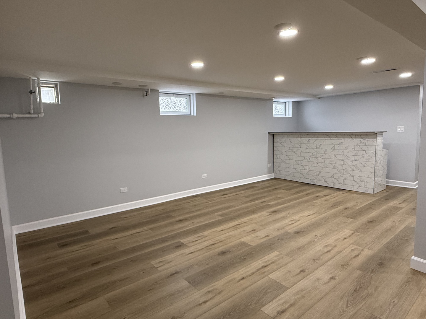 10061 Lacrosse Avenue Skokie, IL 60077 - Photo 11 of 19 an empty room with wooden floor and windows