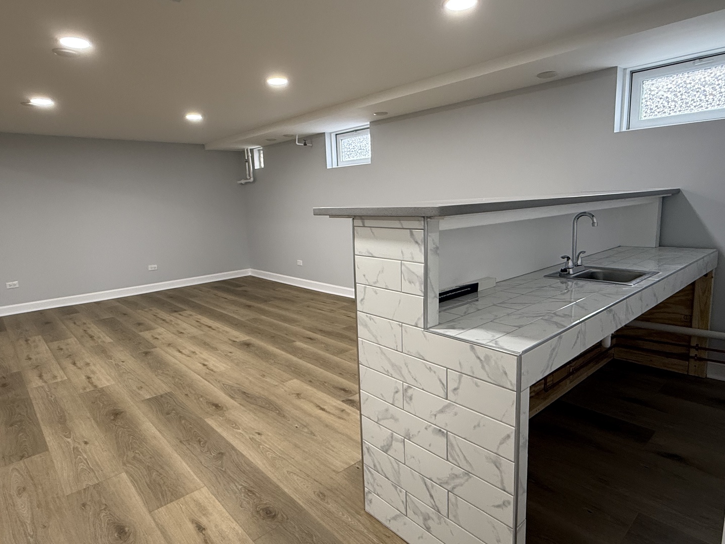 10061 Lacrosse Avenue Skokie, IL 60077 - Photo 12 of 19 a kitchen with a sink cabinets and wooden floor